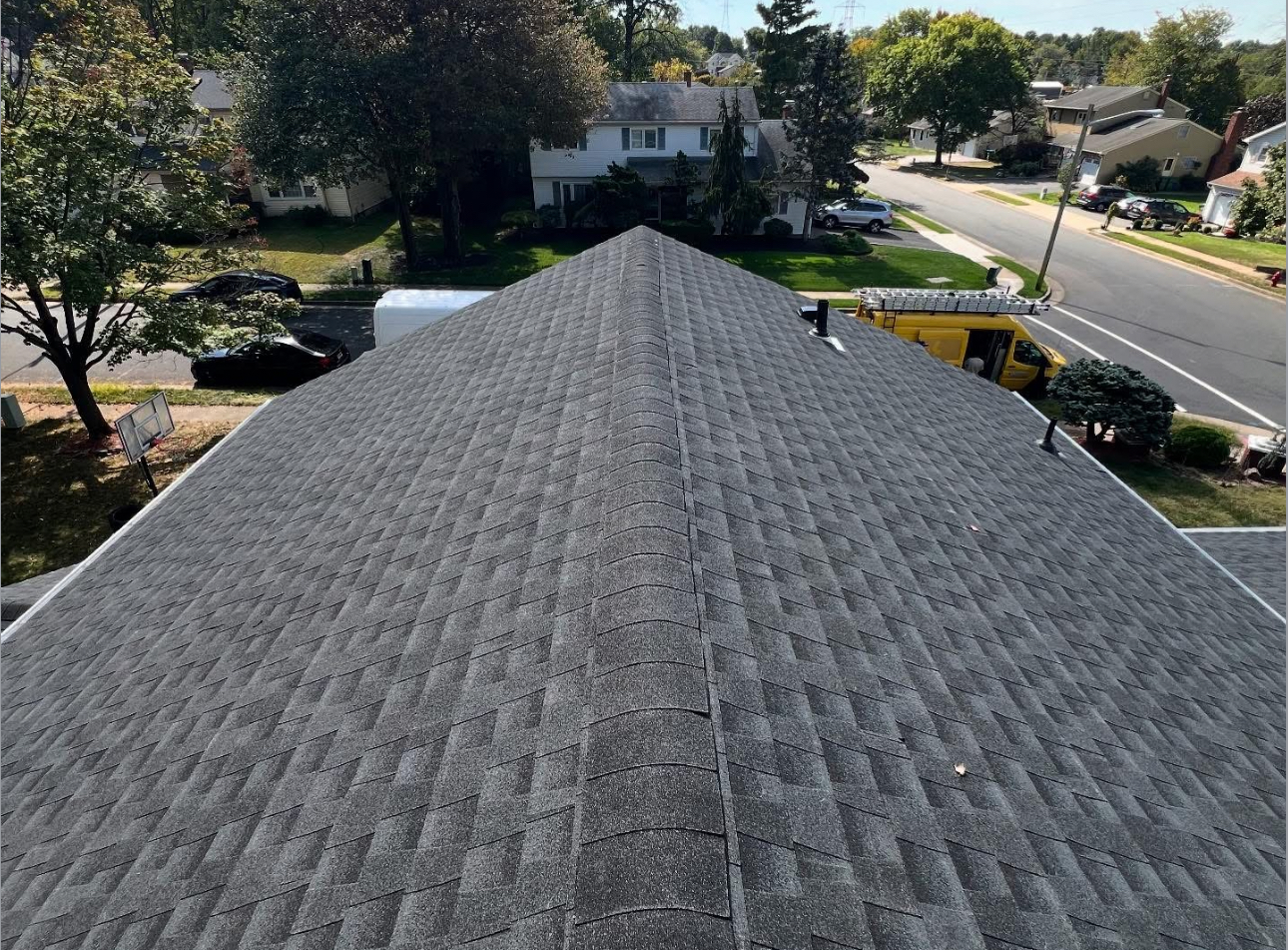Completed gray shingle roof - ridge view