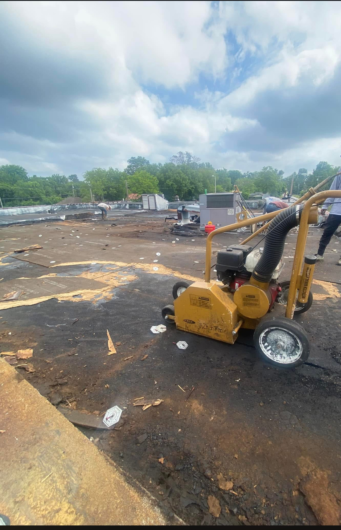 Commercial roof tear-off with equipment