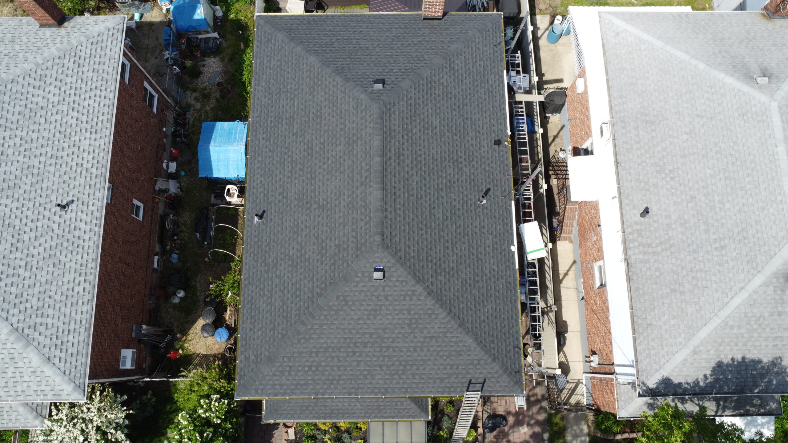 Completed shingle roof replacement - aerial view